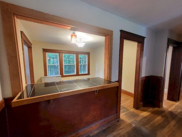 12 Allen St, Wilton, ME 04294 - unfurnished dining area with wood finished floors and baseboards