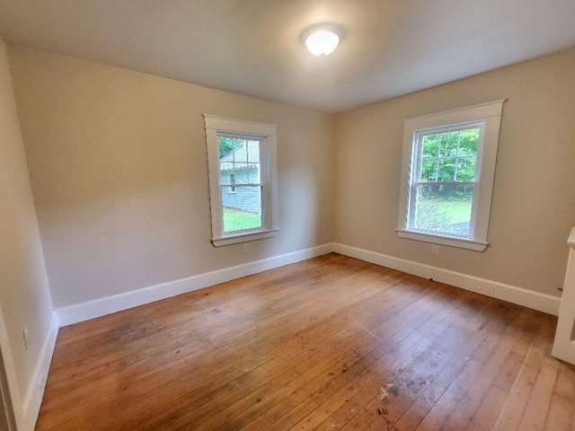 12 Allen St, Wilton, ME 04294 - empty room with light wood-type flooring and plenty of natural light