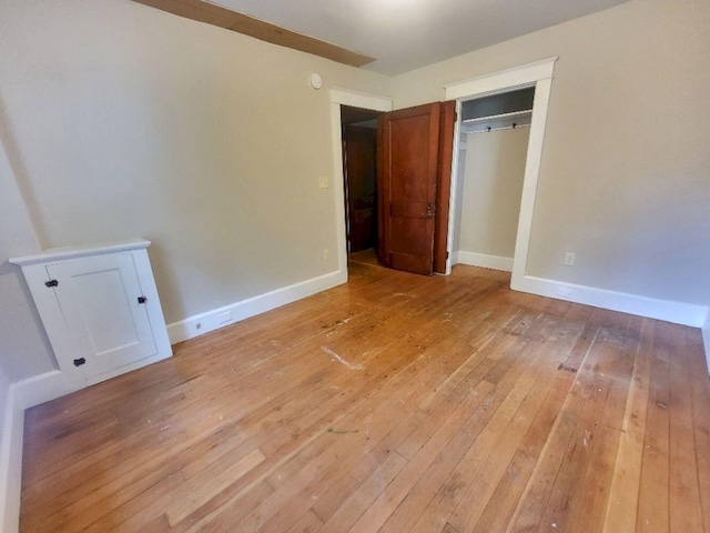 12 Allen St, Wilton, ME 04294 - unfurnished bedroom with light wood-style floors and a closet