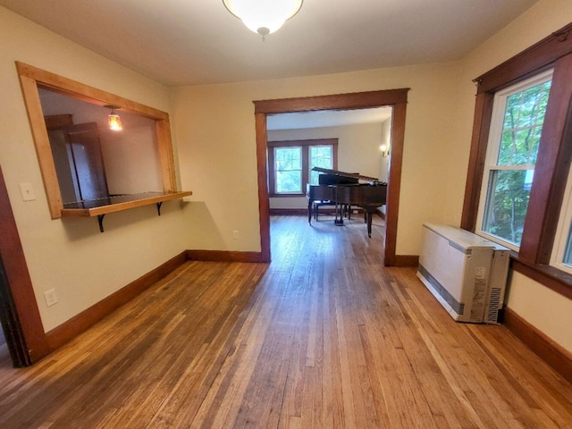 12 Allen St, Wilton, ME 04294 - hallway featuring wood finished floors and heating unit