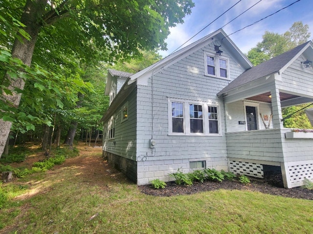 12 Allen St, Wilton, ME 04294 - view of side of home with a lawn