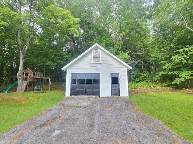 12 Allen St, Wilton, ME 04294 - detached garage featuring asphalt driveway