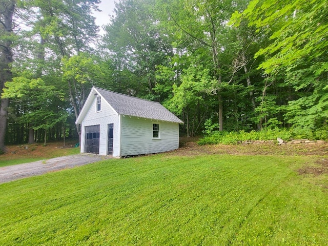 12 Allen St, Wilton, ME 04294 - view of green lawn featuring a garage and an outdoor structure