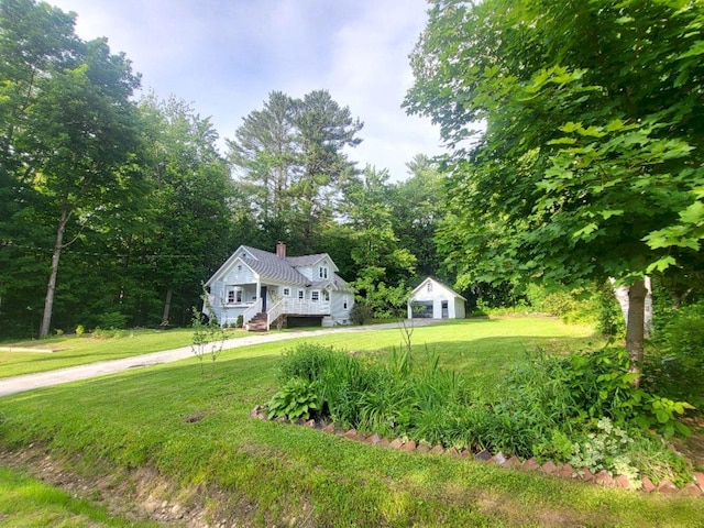12 Allen St, Wilton, ME 04294 - view of front facade featuring a front yard and a chimney