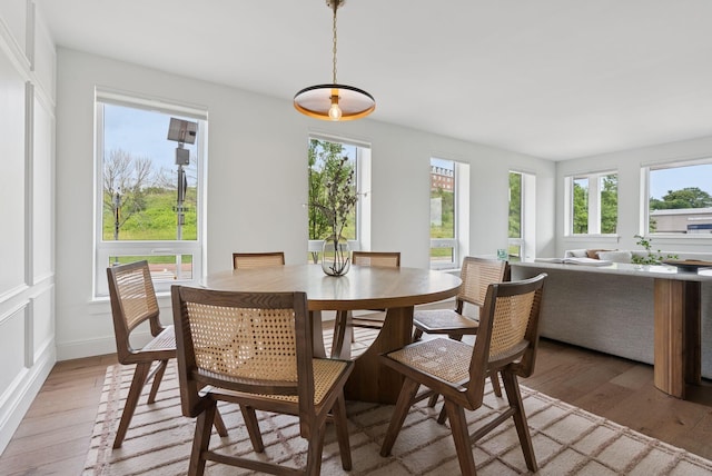 218 Washington Ave Unit 107, Portland, ME 04101 - dining room with light wood-style flooring and baseboards