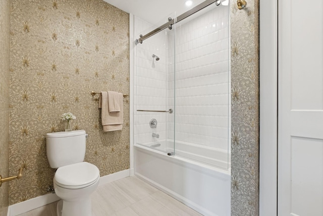 218 Washington Ave Unit 107, Portland, ME 04101 - bathroom featuring combined bath / shower with glass door and baseboards