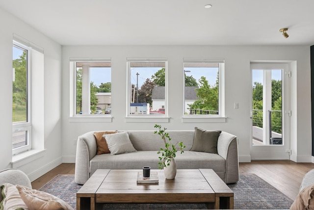 218 Washington Ave Unit 107, Portland, ME 04101 - living room with healthy amount of natural light and wood finished floors