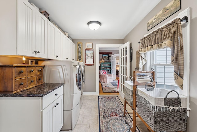 709 High St, Bath, ME 04530 - washroom featuring cabinet space, washing machine and clothes dryer, light tile patterned floors, and french doors