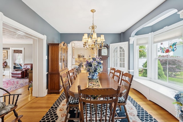 709 High St, Bath, ME 04530 - dining space with a chandelier and light wood-style floors
