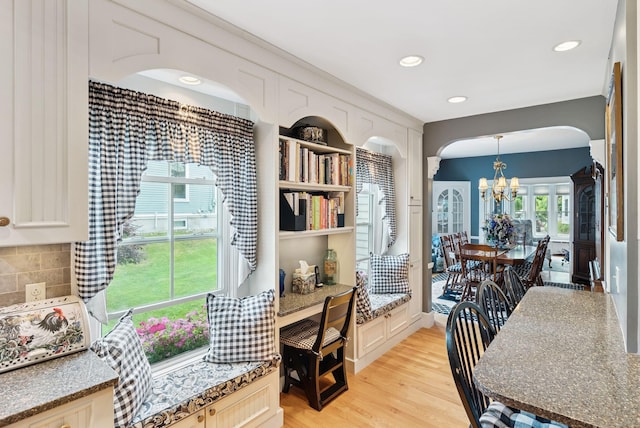 709 High St, Bath, ME 04530 - dining room with a chandelier, arched walkways, light wood-type flooring, and recessed lighting