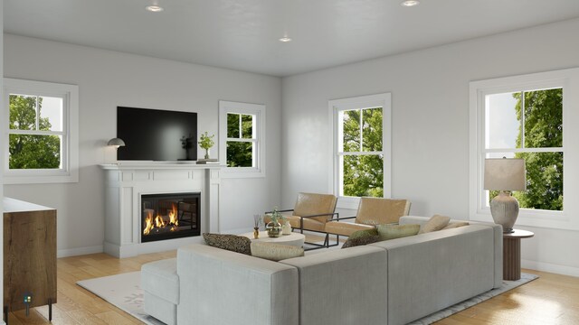 LOT29 Sagamore Dr Unit 29, Tbb, Phippsburg, ME 04562 - living room with a glass covered fireplace, healthy amount of natural light, light wood-style flooring, and recessed lighting