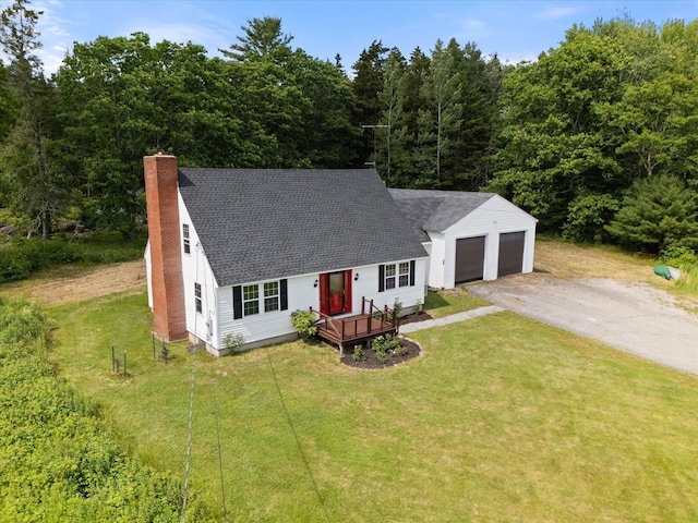 24 Blackswoods Rd, Franklin, ME 04634 - view of front of property featuring a chimney, asphalt driveway, a front yard, a shingled roof, and an attached garage