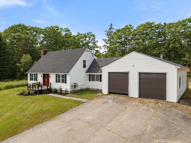 24 Blackswoods Rd, Franklin, ME 04634 - view of front facade with a chimney, roof with shingles, a front yard, and an attached garage