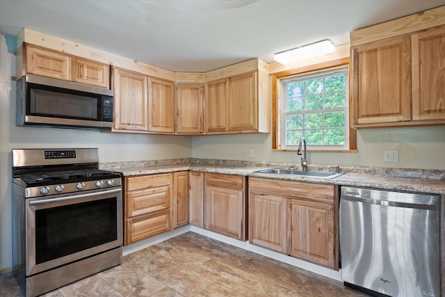24 Blackswoods Rd, Franklin, ME 04634 - kitchen with stainless steel appliances, light brown cabinetry, and light countertops
