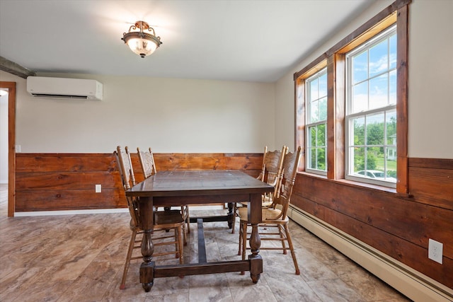24 Blackswoods Rd, Franklin, ME 04634 - dining area with a baseboard radiator, a wall mounted AC, wainscoting, and wood walls