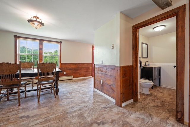 24 Blackswoods Rd, Franklin, ME 04634 - dining room with wainscoting and a baseboard heating unit
