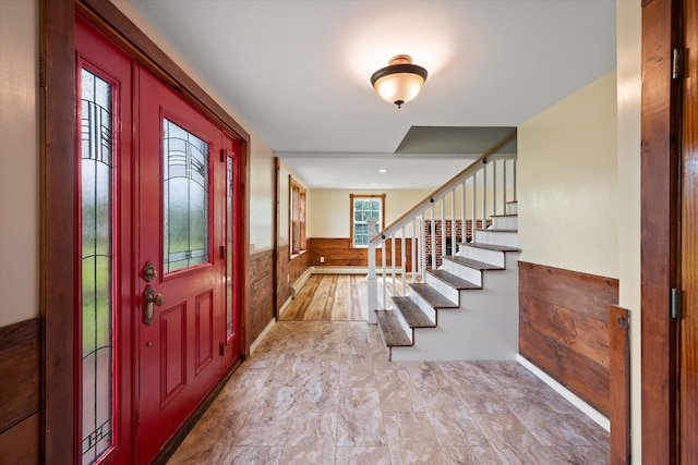 24 Blackswoods Rd, Franklin, ME 04634 - foyer with a wainscoted wall, stairway, and wood walls