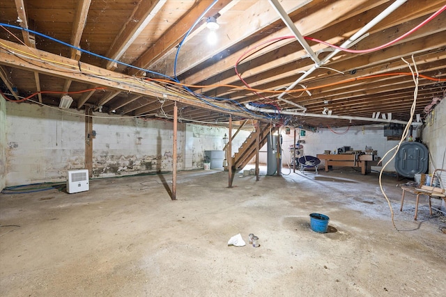 24 Blackswoods Rd, Franklin, ME 04634 - unfinished basement with oil tank, water heater, and concrete block wall