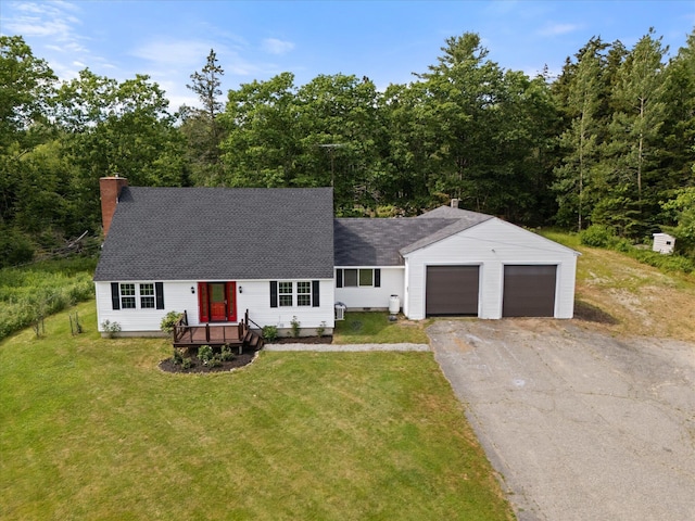 24 Blackswoods Rd, Franklin, ME 04634 - view of front of house with asphalt driveway, a shingled roof, a front yard, a chimney, and an attached garage