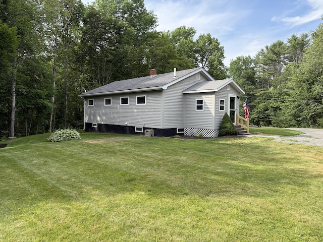 429 Rte 3, Palermo, ME 04354 - view of home's exterior featuring a yard, a chimney, and a shingled roof