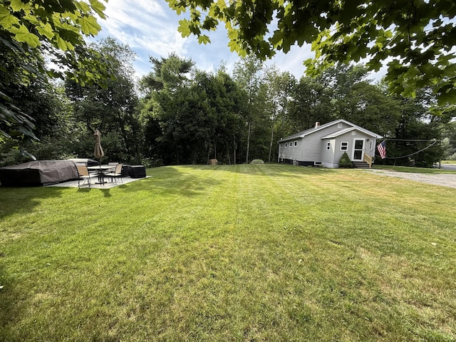 429 Rte 3, Palermo, ME 04354 - view of green lawn featuring a patio