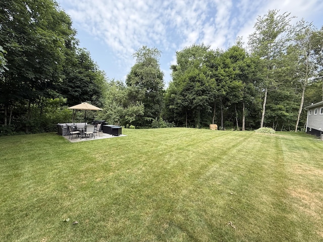 429 Rte 3, Palermo, ME 04354 - view of green lawn featuring a patio and outdoor lounge area