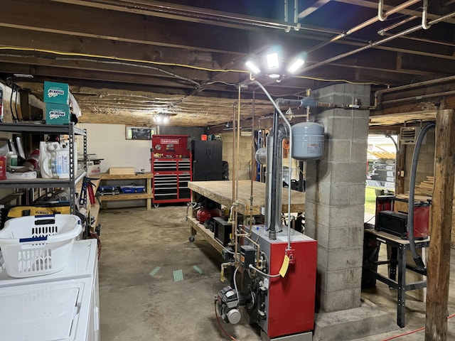 429 Rte 3, Palermo, ME 04354 - below grade area featuring a workshop area, a heating unit, and concrete block wall