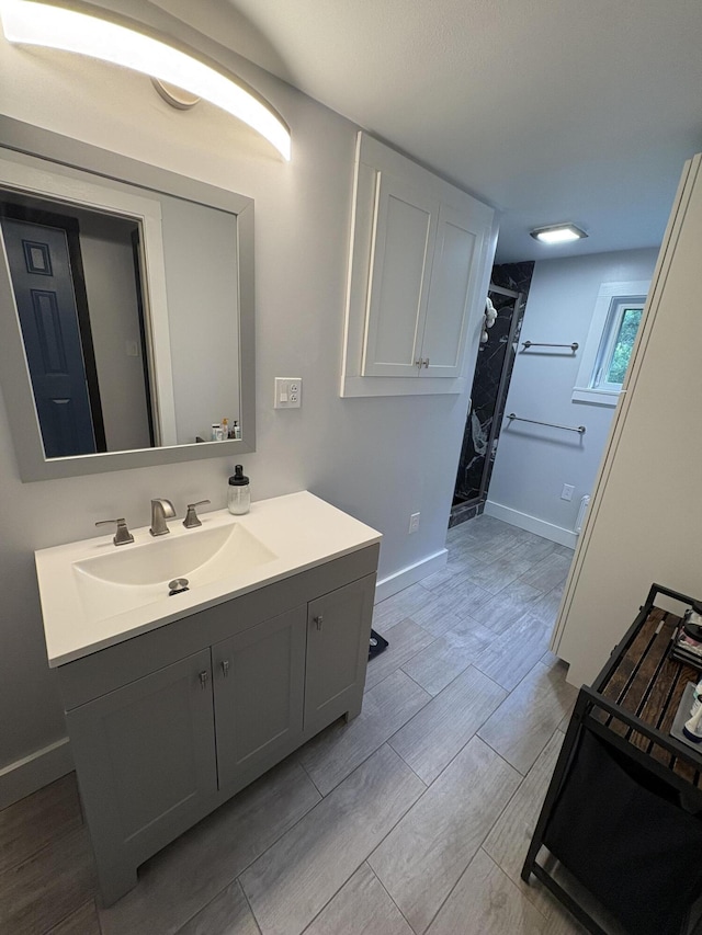 429 Rte 3, Palermo, ME 04354 - bathroom with vanity, a shower, and wood tiled floors