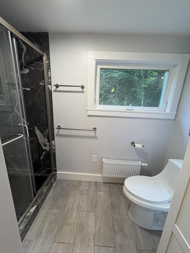 429 Rte 3, Palermo, ME 04354 - full bath featuring radiator, wood finished floors, and a marble finish shower