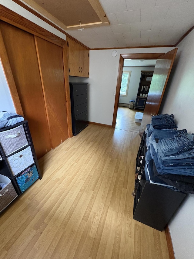 429 Rte 3, Palermo, ME 04354 - kitchen with light wood-style floors and brown cabinetry