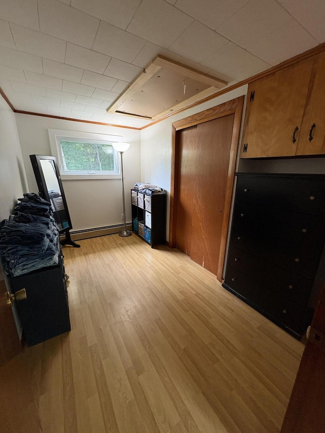 429 Rte 3, Palermo, ME 04354 - kitchen with light wood-style floors, a baseboard heating unit, and brown cabinets