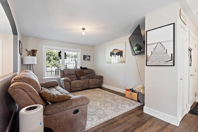 15 Fieldstone Dr, Augusta, ME 04330 - living room with wood finished floors and arched walkways