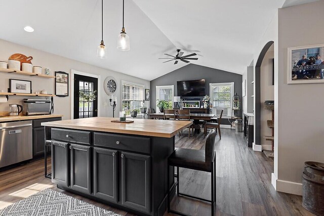 15 Fieldstone Dr, Augusta, ME 04330 - kitchen with butcher block counters, dishwasher, a ceiling fan, vaulted ceiling, and a breakfast bar