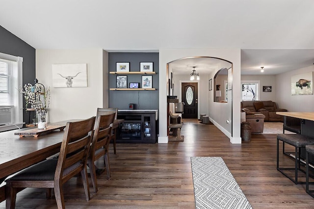 15 Fieldstone Dr, Augusta, ME 04330 - dining room featuring arched walkways and dark wood-style flooring
