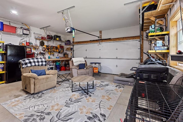 15 Fieldstone Dr, Augusta, ME 04330 - garage featuring freestanding refrigerator and a garage door opener