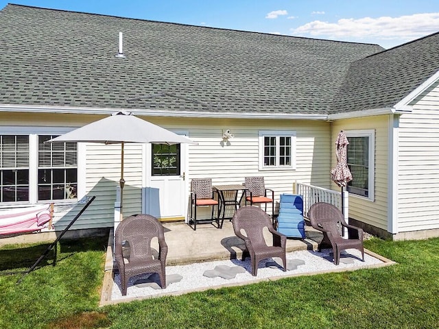 15 Fieldstone Dr, Augusta, ME 04330 - back of property with a patio area, a shingled roof, and a yard