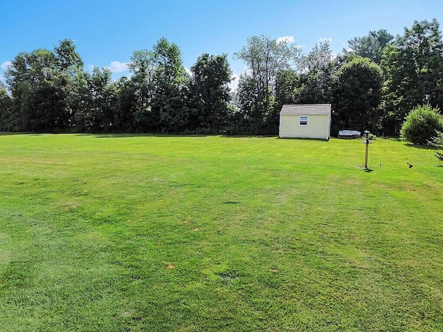 15 Fieldstone Dr, Augusta, ME 04330 - view of green lawn featuring a storage shed