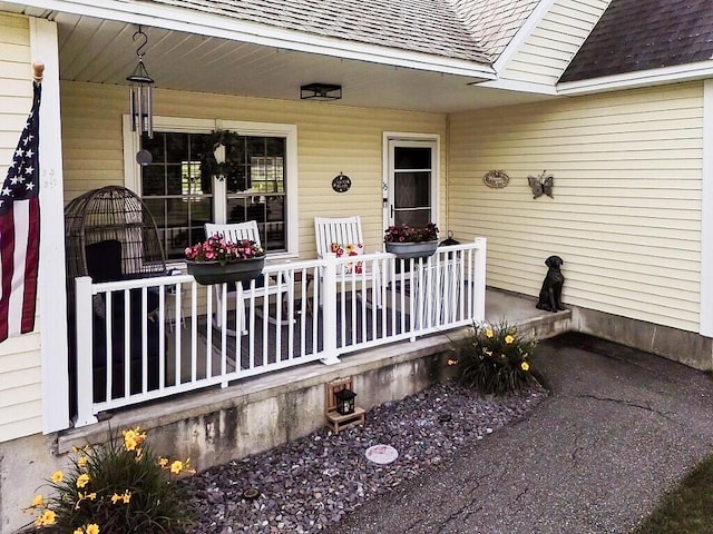 15 Fieldstone Dr, Augusta, ME 04330 - property entrance with a porch and a shingled roof
