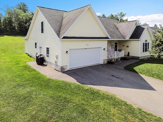 15 Fieldstone Dr, Augusta, ME 04330 - traditional home featuring a garage, asphalt driveway, a front yard, and roof with shingles