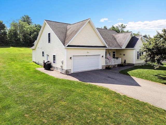15 Fieldstone Dr, Augusta, ME 04330 - traditional-style home with a garage, asphalt driveway, a front yard, and a shingled roof