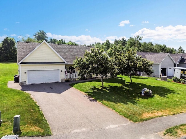 15 Fieldstone Dr, Augusta, ME 04330 - view of front facade featuring driveway, an attached garage, a front yard, and roof with shingles