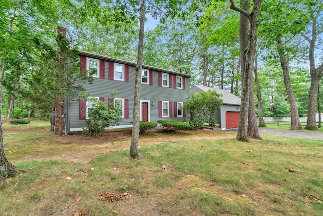 14 Pinewood Cir, Biddeford, ME 04005 - colonial inspired home with a garage, a chimney, driveway, and a front lawn