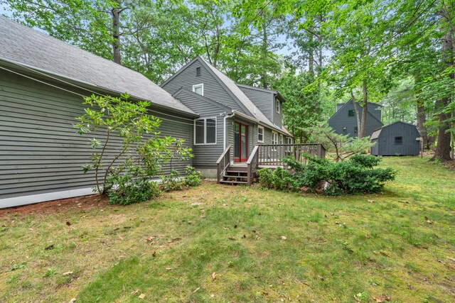 14 Pinewood Cir, Biddeford, ME 04005 - view of front of home featuring a shed, a wooden deck, and a front lawn
