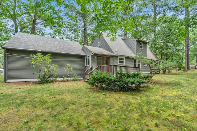 14 Pinewood Cir, Biddeford, ME 04005 - view of front facade with a wooden deck, a front lawn, french doors, and a shingled roof