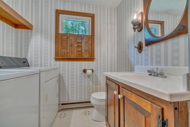14 Pinewood Cir, Biddeford, ME 04005 - bathroom featuring washer and dryer, baseboard heating, wallpapered walls, tile patterned flooring, and vanity