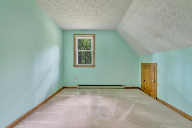 14 Pinewood Cir, Biddeford, ME 04005 - bonus room featuring a baseboard heating unit, a textured ceiling, lofted ceiling, and carpet floors