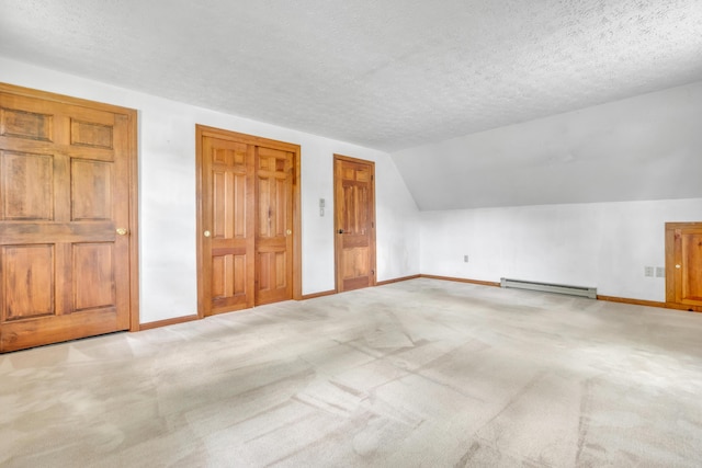 14 Pinewood Cir, Biddeford, ME 04005 - additional living space featuring baseboard heating, carpet, lofted ceiling, and a textured ceiling