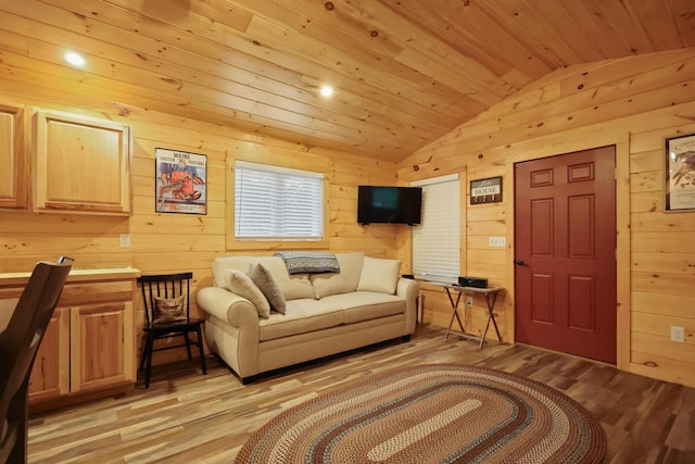 92 Cottage Shore Dr, Holden, ME 04429 - living area with vaulted ceiling, wooden ceiling, light wood-style floors, and wood walls