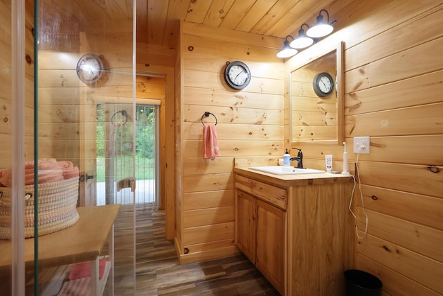 92 Cottage Shore Dr, Holden, ME 04429 - bathroom featuring wooden walls, wood finished floors, vanity, and wood ceiling