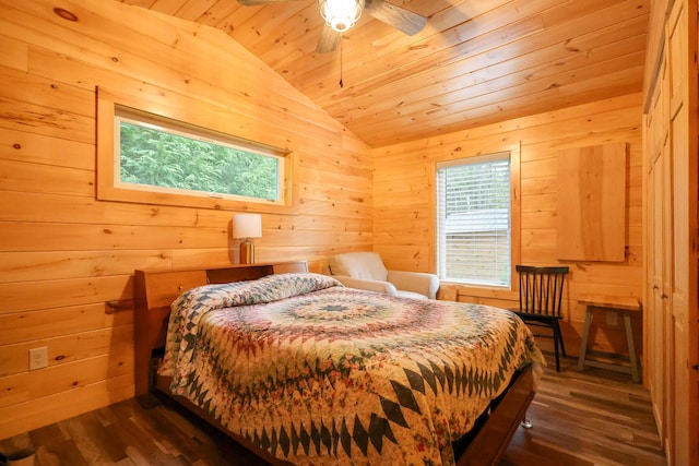 92 Cottage Shore Dr, Holden, ME 04429 - bedroom with lofted ceiling, wooden ceiling, dark wood-style flooring, and wood walls